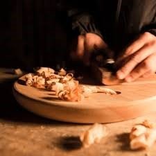 Quality-checking sheesham wood finish by hand